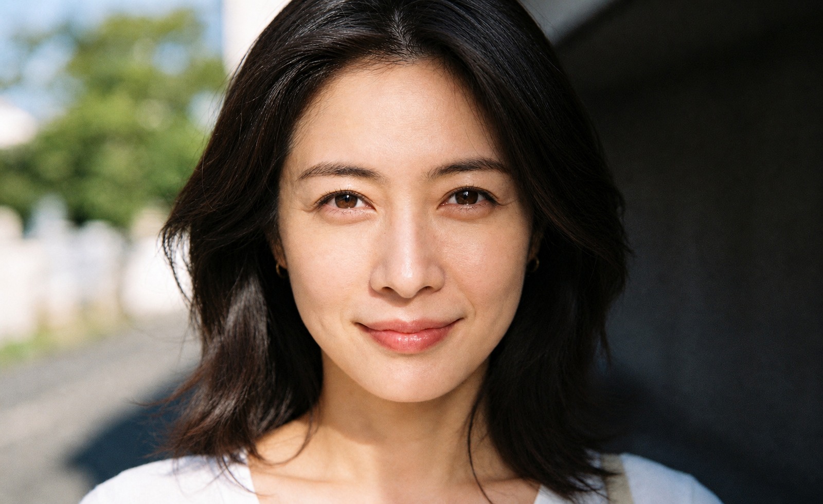 Portrait after: the face is evenly lit, skin texture intact